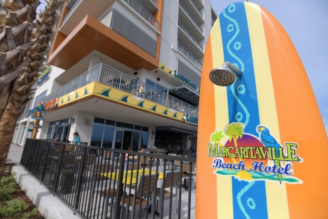 Showers built into surfboards are just some of the features built into Jacksonville Beach's newest oceanfront hotel, Margaritaville Beach Hotel. The $50 million, 200-room hotel opened Tuesday.