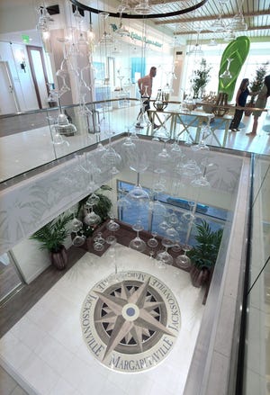 Margarita glasses form a chandelier from the second-floor lobby to the ground floor of the Margaritaville Beach Hotel.