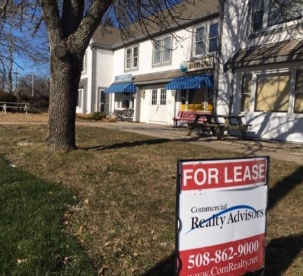 Empty storefronts are visible in multiple locations in Orleans, including this one on Main Street next to Post Office Square. [Donna Tunney/Cape Codder]