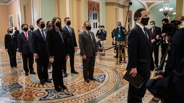 Democratic House impeachment managers deliver an a