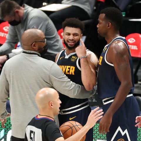 Denver Nuggets guard Jamal Murray (27) reacts afte