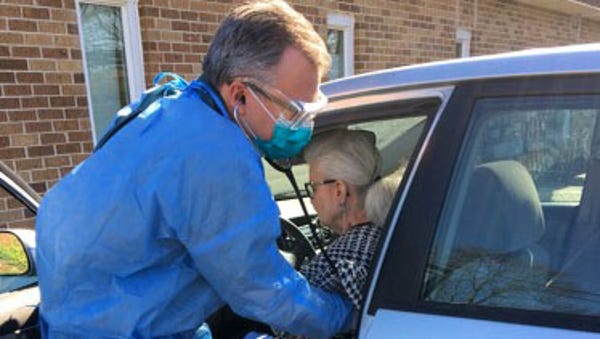 Dr. Keith Sadel cares for a patient from his Upper