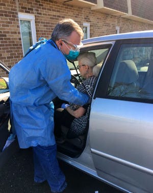 Dr. Keith Sadel cares for a patient from his Upper Southampton family practice, which has been trying to get the vaccine for its patients for two months. Many primary care physicians, who are unable to get the vaccine before pharmacies and other medical specialists, are upset the rollout is leaving them out.