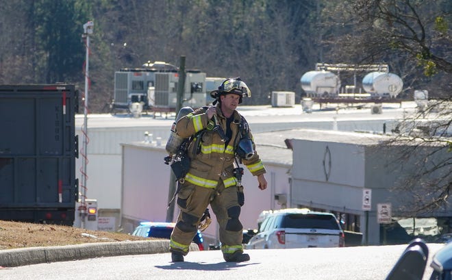 A Hall County firefighter leaves following a liquid nitrogen leak that killed six people at Prime Pak Foods, a poultry plant, on Thursday, Jan. 28, 2021, in Gainesville, Ga. (AP Photo/John Bazemore)