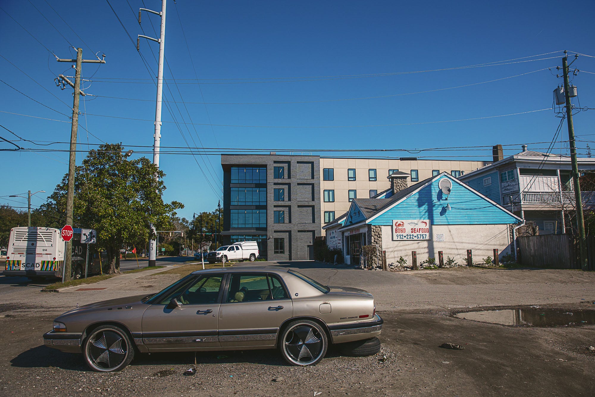 The Savannah College of Art and Design’s recently completed Victory Village student housing is visible over the homes and businesses located behind it on Montgomery Street.