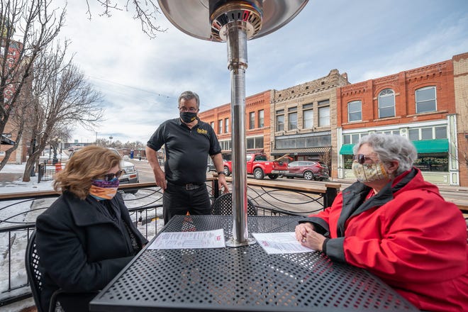 Mike Pacheco, owner of Papa Jose’s Union Cafe, speaks with patrons Vicky Winterscheidt, left, and Mona Klein on Thursday January 28, 2021.
