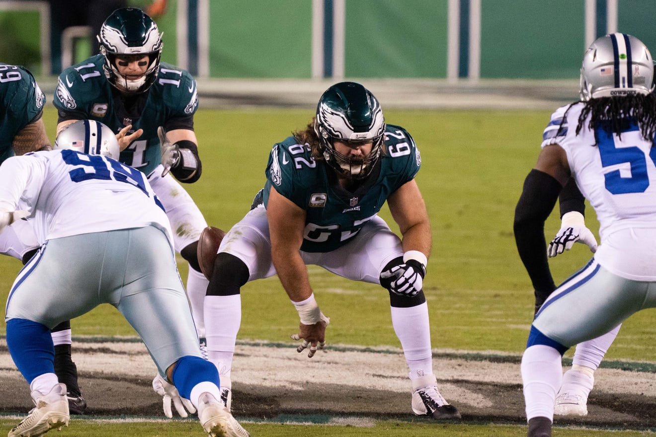 Nov 1, 2020; Philadelphia, Pennsylvania, USA; Philadelphia Eagles center Jason Kelce (62) snaps the ball to quarterback Carson Wentz (11) against the Dallas Cowboys during the second quarter at Lincoln Financial Field.
