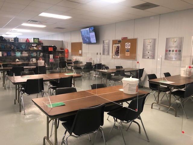 The Seneca Foods premises in Gillett taken on July 21, 2020, according to records of the Wisconsin Department of Workforce Development. One of the workers said the photo shows the plant's cafeteria. Tables are set up with dividers to separate employees.