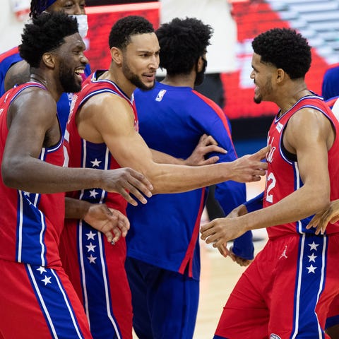 Tobias Harris (12) and the Sixers celebrate after 