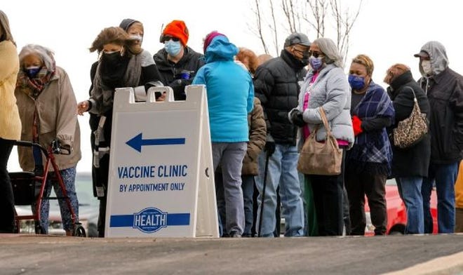 People wait in line to receive a COVID-19 vaccine at Ebenezer Baptist Church in Oklahoma City on Jan. 26.