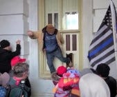 A photo posted on the Facebook page of Troy Elbert Faulkner, 39, of Whitehall, shows him kicking in a window during the insurrection rioting Jan. 6 at the U.S. Capitol, according to a criminal complaint filed in the U.S. District Court of the District of Columbia.