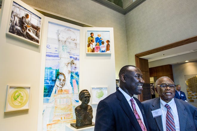 Benjamin Crump, President of the national Bar Association, left, and Civil Rights Attorney Fred Gray, right, pause to talk with members of the media as lawyers with the National Bar Association visit the Rosa Parks Museum in Montgomery, Ala. as part of their tour commemorating the 60th anniversary of the Montgomery Bus Boycott on Monday November 30, 2015.