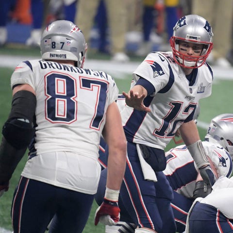 Former Patriots Tom Brady (12) and Rob Gronkowski 