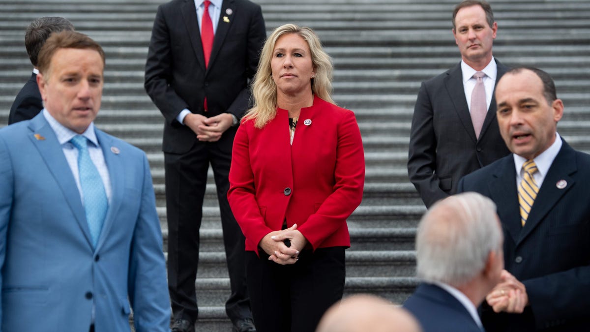 Rep. Marjorie Taylor Greene of Georgia stands alongside fellow first-term Republican members of Congress on the steps of the U.S. Capitol in Washington, DC, Jan. 4, 2021.