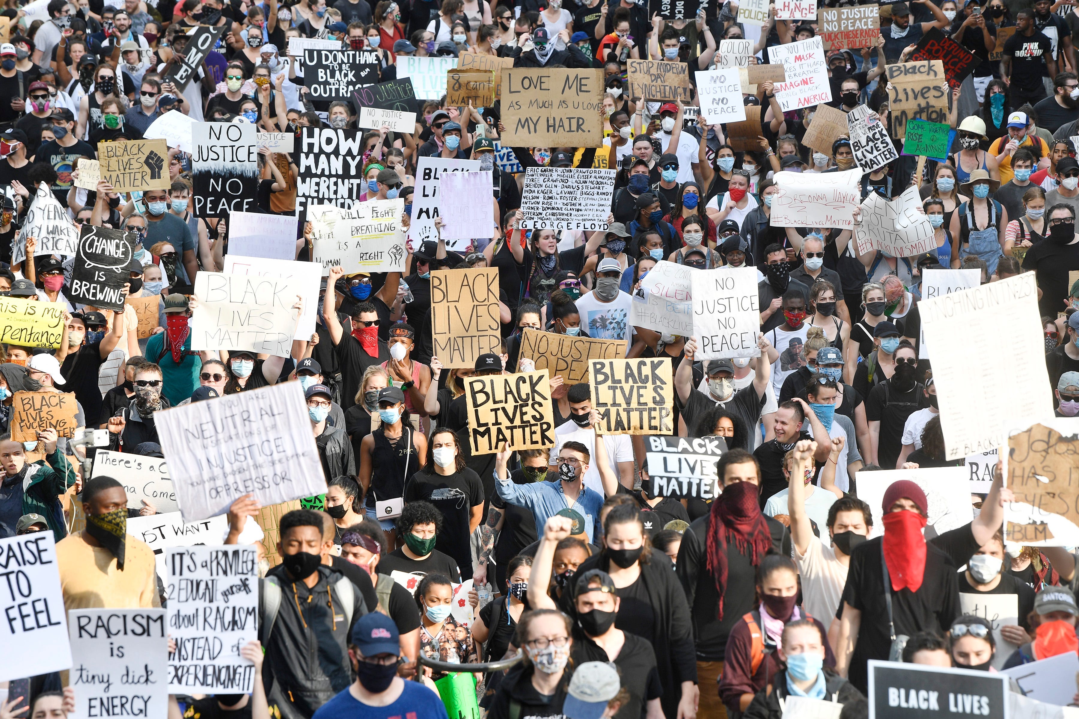 Protesters march through downtown Nashville, Tenn., Thursday, June 4, 2020. Protests continued in Nashville following the death of George Floyd, who died after being pinned down while handcuffed by Minneapolis police officers on Memorial Day.