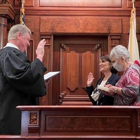 Sally Turner, center, is sworn into the Illinois S