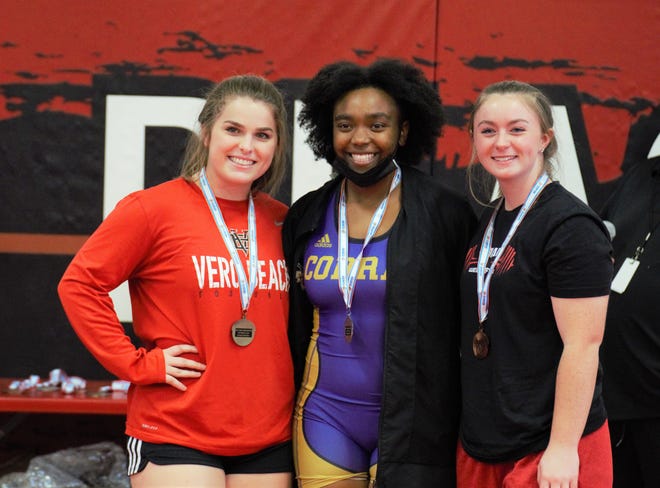 The Treasure Coast area swept the podium in the 169-pound division as Vero Beach’s Avery Teske, left, took the championship with Fort Pierce Central’s Jerneka Davis coming in second and Vero Beach’s Mackenzie Tessier finishing third at the Region 4-3A girls weightlifting meet at Vero Beach High School on Saturday, Jan. 30, 2021.