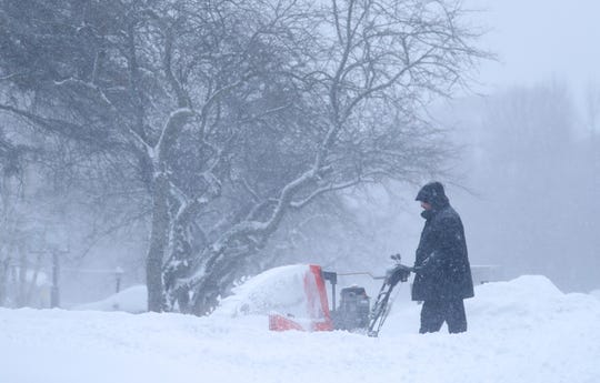 Joel Berman uses a snowblower to clear snow from his driveway Sunday, Jan. 31, 2021 in Bayside, Wis.