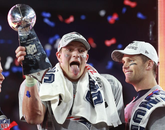 Rob Gronkowski, left, and Tom Brady celebrate winning Super Bowl XLIX in Arizona against the Seattle Seahawks in 2015. Gronk and Brady are playing in another Super Bowl, on Sunday against the Chiefs, as teammates on the NFC champion Tampa Bay Buccaneers.