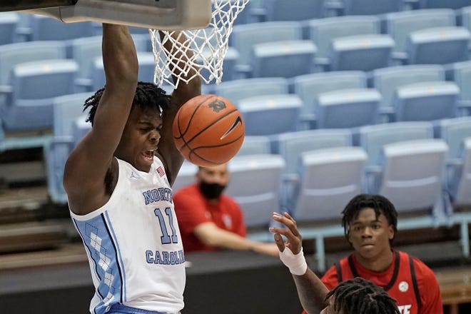 Day’Ron Sharpe dunks during North Carolina’s victory against N.C. State last month.