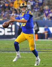 Los Angeles Rams quarterback Jared Goff throws a touchdown pass against the Minnesota Vikings at the Los Angeles Memorial Coliseum, Sept. 27, 2018.