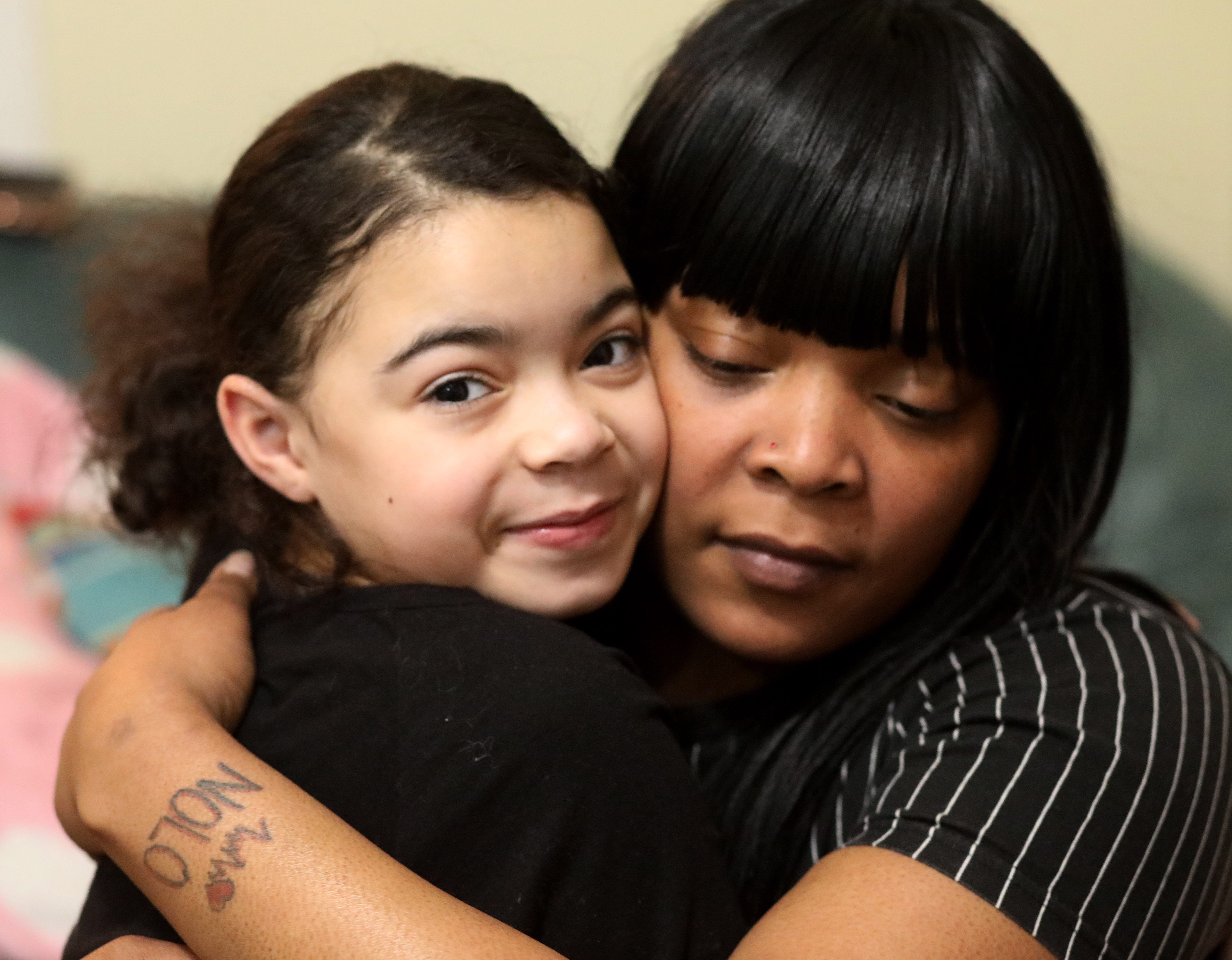 Kendra Smith embraces her daughter Diamond Yeno at their home in City of Poughkeepsie on January 28, 2021. Kendra's life has been deeply impacted by gun violence and loss, but she has overcome her challenges and works every day to protect her daughter from experiencing similar loss. 