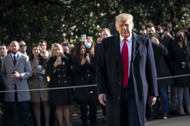 U.S. President Donald Trump turns to reporters as he exits the White House to walk toward Marine One on Jan. 12. (Drew Angerer/Getty Images/TNS]