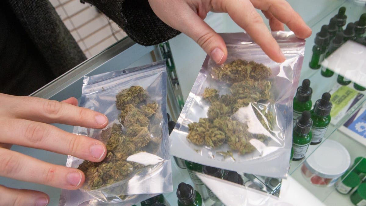 Varieties of CBD flower, a nonpsychoactive ingredient in marijuana, are sold Tuesday at Sacred Leaf. The store sells a large variety of full-spectrum CBD products legally but is restricted by the state from selling anything that contains over 5% THC, the psychoactive ingredient in marijuana.