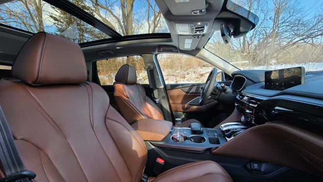 The 2022 Acura MDX comes standard with panoramic sun roof, leather seats and loads of interior tech.