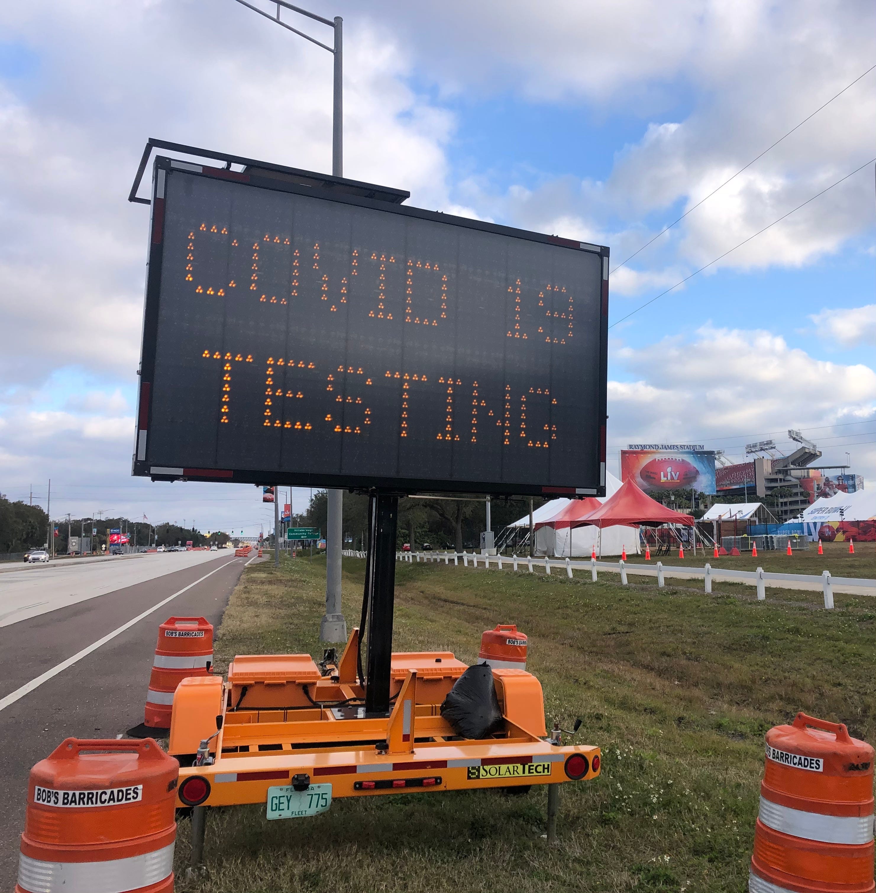 COVID-19 testing sign near Raymond James Stadium.