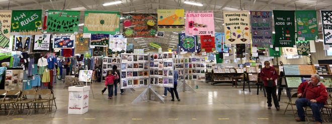 Banners, photography, clothing and textiles and entomology entries are just some of the many projects displayed in the 4-H Centennial Hall at the Kansas State Fair in this September 2014 photo. The Fair Board agreed to changes in entries for public and 4-H Fair exhibit entries.