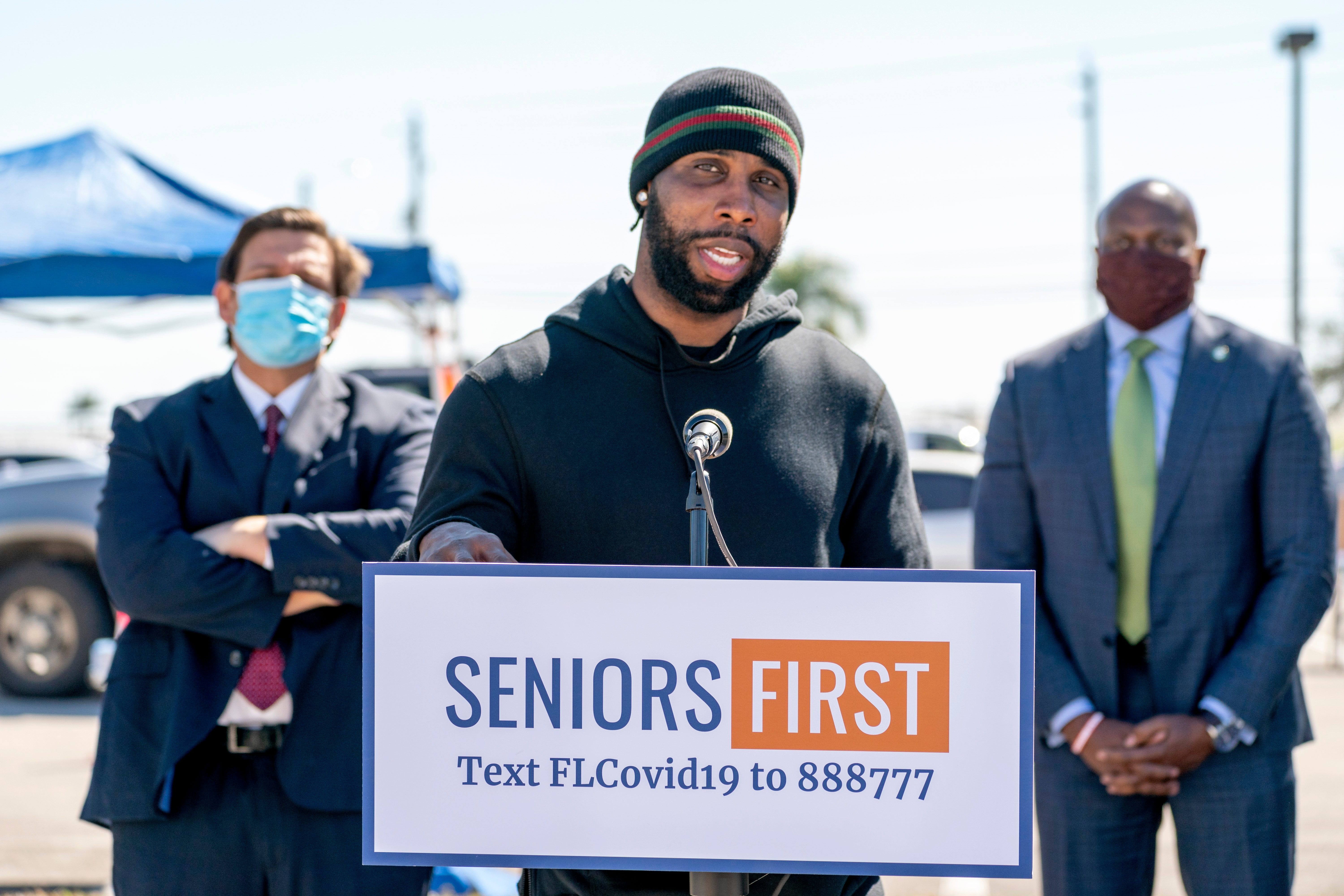 Retired NFL wide receiver and Pahokee High School star Anquan Boldin speaks during a press conference with Florida Gov. Ron DeSantis at a COVID-19 vaccination site at Anquan Boldin Stadium in Pahokee. It was in 2021 in the height of the pandemic when the Glades was a hotspot for the virus.