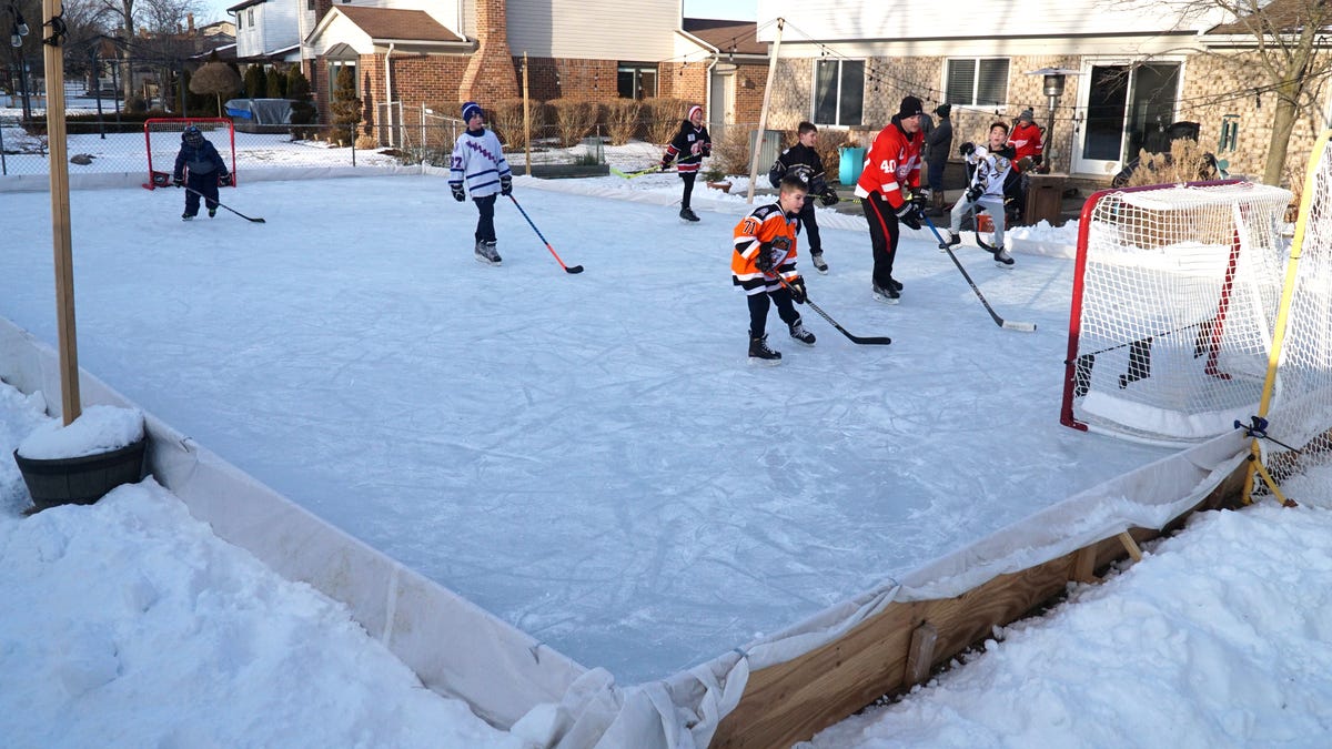 Fun at a backyard hockey rink in Canton