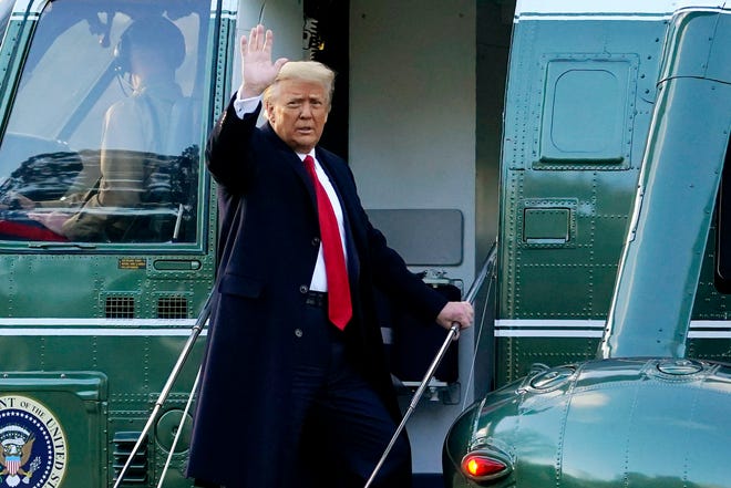 In this Wednesday, Jan. 20, 2021, file photo, President Donald Trump waves as he boards Marine One on the South Lawn of the White House, in Washington, en route to his Mar-a-Lago Florida Resort, just hours before Joe Biden's inauguration.