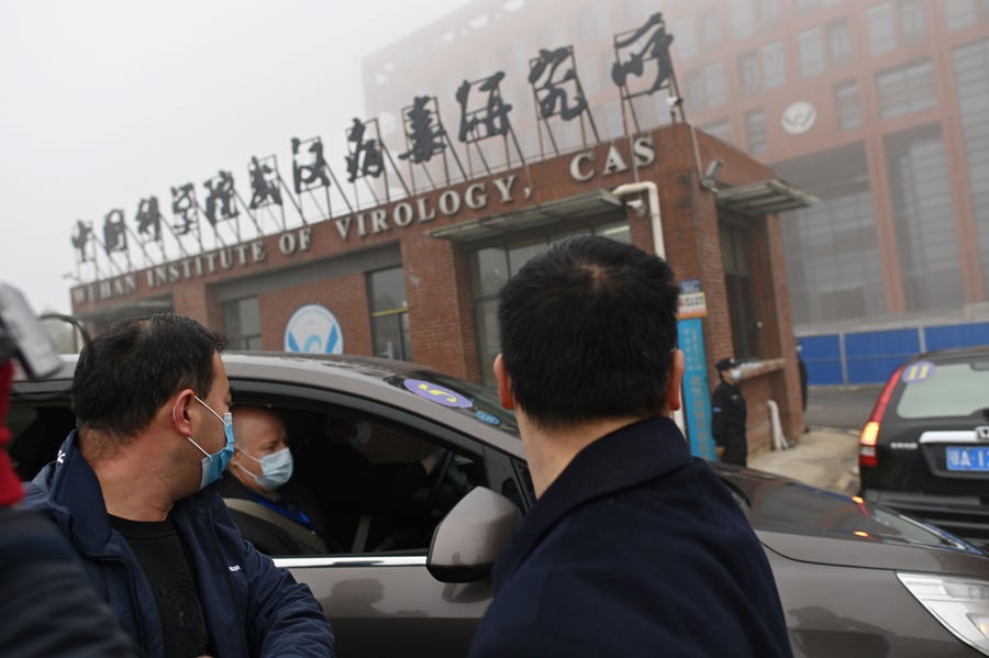 Members of the World Health Organization (WHO) team investigating the origins of the COVID-19 coronavirus arrive by car at the Wuhan Institute of Virology in Wuhan in China's central Hubei province on Feb. 3, 2021.