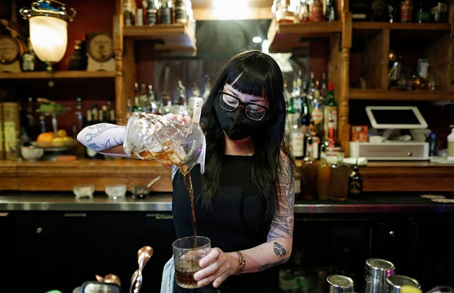 Bartender Shea Bainbridge makes a drink at Two Truths bar in Columbus on February 3, 2020.