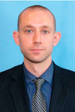In this undated photo provided by the FBI shows agent Daniel Alfin, who was fatally shot Tuesday, Feb. 2, 2021 while serving a search warrant at the home of a child pornography suspect in Sunrise, Fla.