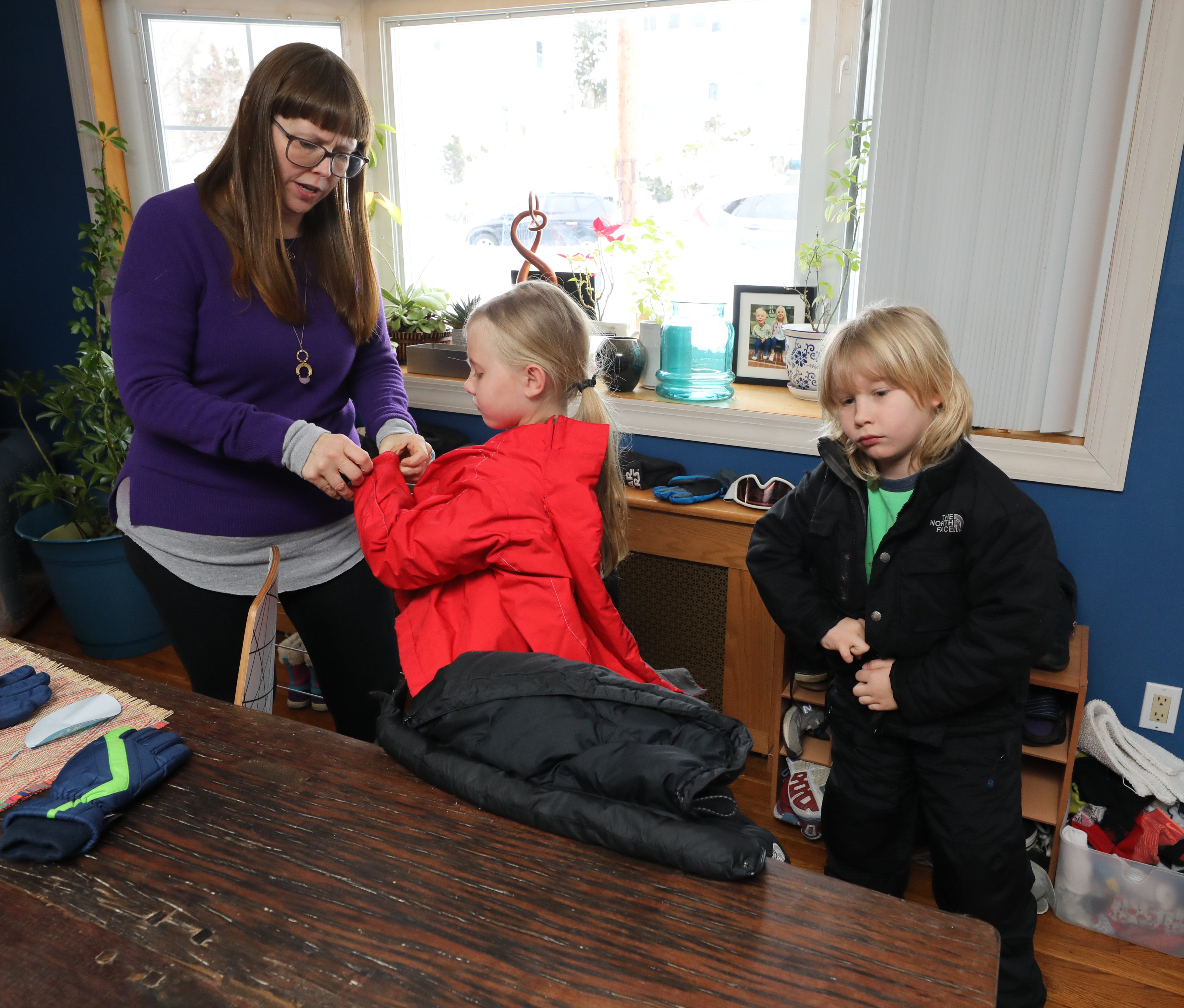 For every family, remote learning brings its own set of challenges. For Julia Wright Rogers, shown here preparing her 7-year-old twins Primrose and Angus for some playtime in the snow, it also brings a moment for gratitude.