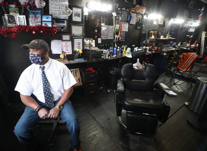 Deone Slater, owner of Kangaroo Kutz Multicutural Barbershop on Rhodes Avenue in Akron, has been hosting biweekly meetings with young boys to discuss the impact of violence on their daily lives and to guide them toward manhood.