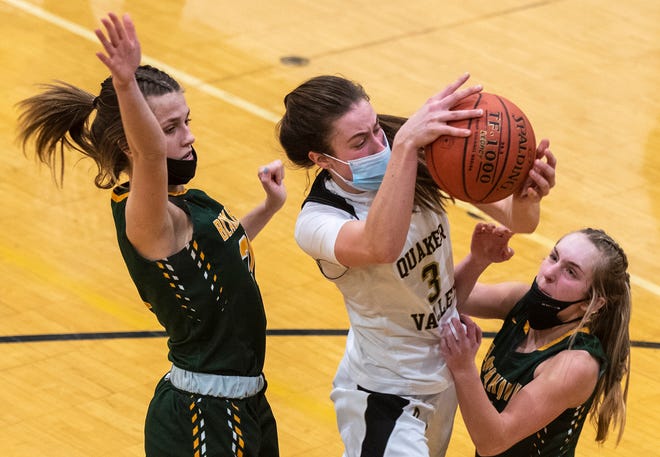 Quaker Valley's Bailey Garbee tries to shoot through Blackhawk's Jolie Strati, left, and Cassie Potts Thursday at Quaker Valley High School in Leetsdale.