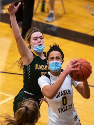 Quaker Valley's Corrine Washington eyes the basket as Blackhawk's Elaina Hildebrand defends Thursday at Quaker Valley High School in Leetsdale.