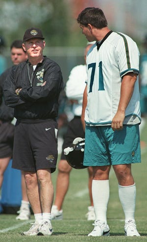 Tom Coughlin chats with offensive lineman Tony Boselli during a 1998 mini-camp.