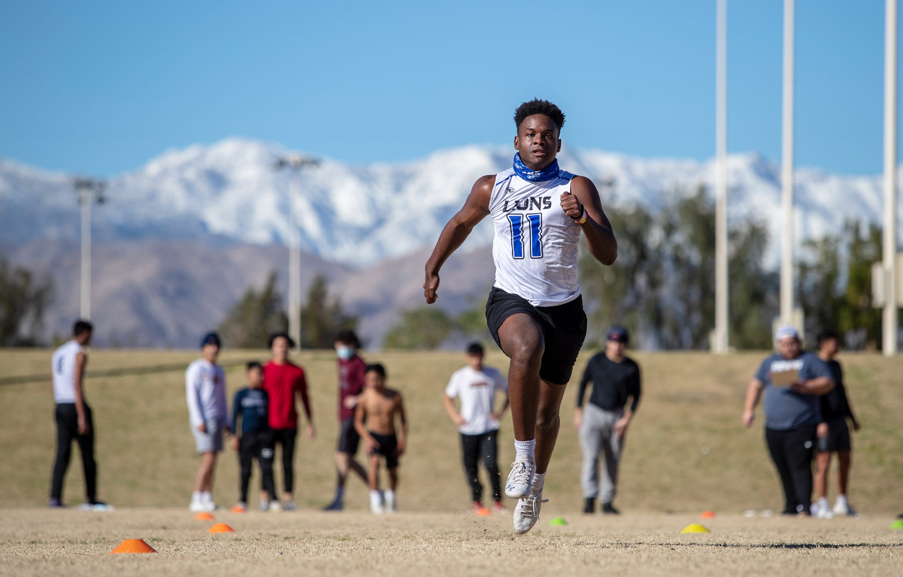 Oshea Wallace, a junior in high school, tries out for the Desert Diablos club football team at La Quinta Park in La Quinta, Calif., on January 30, 2021. 