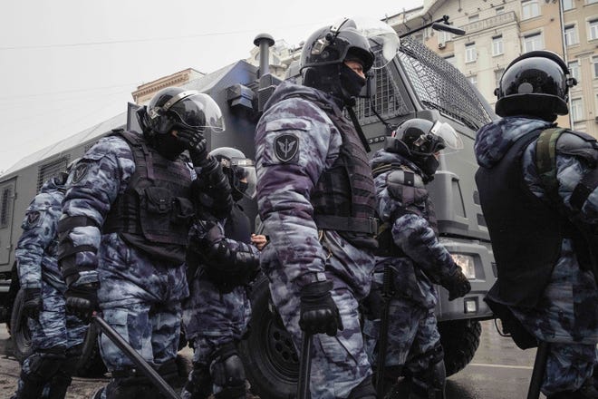 Russian police forces arrive to the scene of a protest in Moscow on Jan. 31, 2021.