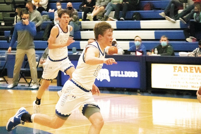 Van Meter's Casey Trudo runs down the court on Friday, Feb. 5 during a home contest against Madrid.