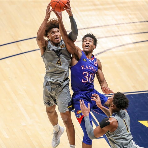 Kansas basketball's Ochai Agbaji, right, and West 