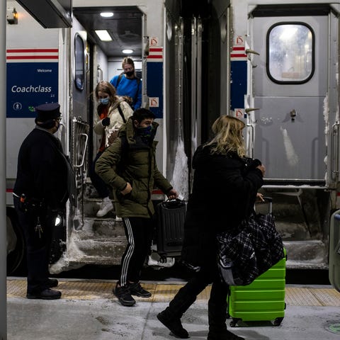 Passengers get off the Amtrak train at the Troy Tr
