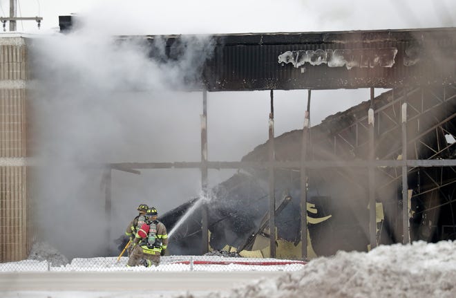 Firefighters work to extinguish a commercial structure fire near Springdale Road and Doral Road just north of I-94 in Waukesha County on Feb. 6.