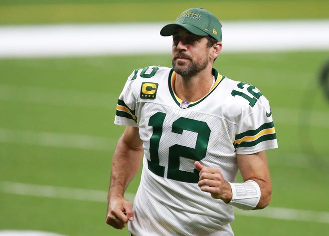 Aaron Rodgers walks off the field after the Green Bay Packers defeated the New Orleans Saints at Mercedes-Benz Superdome on Sept. 27. Other things the Green Bay Packers quarterback did in 2020: "I got engaged."