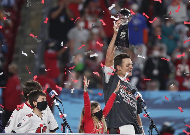 Tampa Bay quarterback Tom Brady celebrates after winning Super Bowl LV against the Kansas City Chiefs on Sunday night at Raymond James Stadium in Tampa, Florida. It's Brady's seventh Super Bowl victory — and first on a team other than the Patriots.